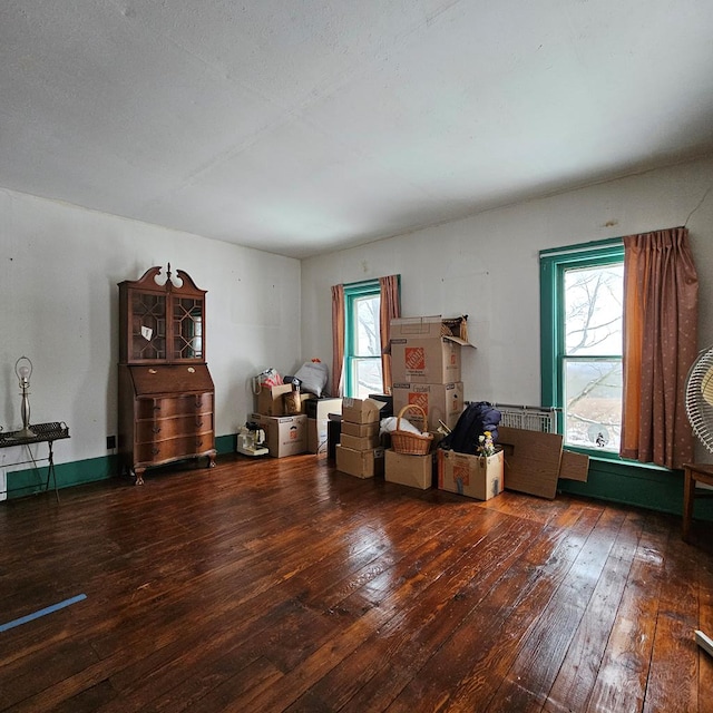 miscellaneous room featuring wood-type flooring and a textured ceiling