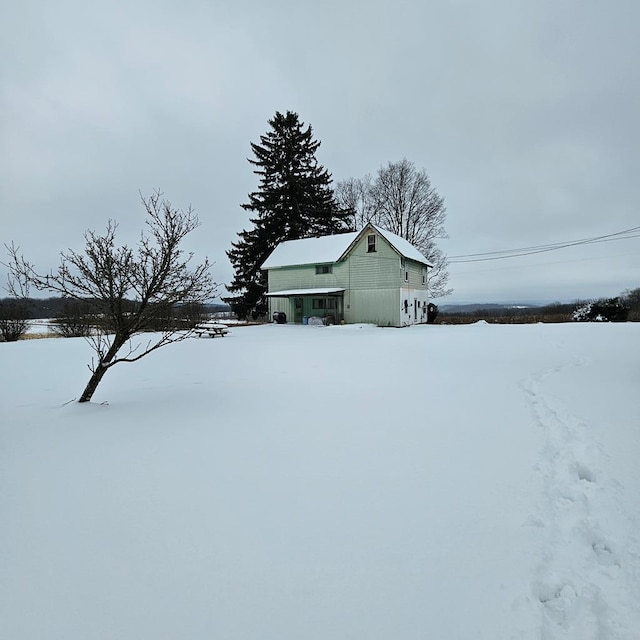 view of yard covered in snow