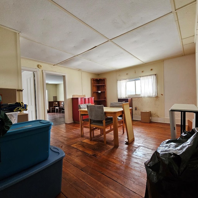 dining room with dark hardwood / wood-style flooring