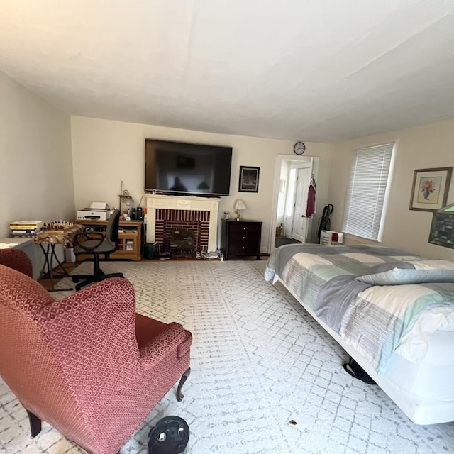 bedroom featuring a fireplace