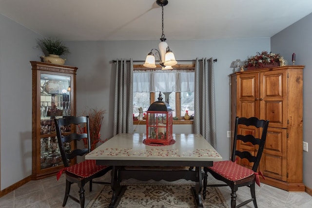 dining area featuring an inviting chandelier