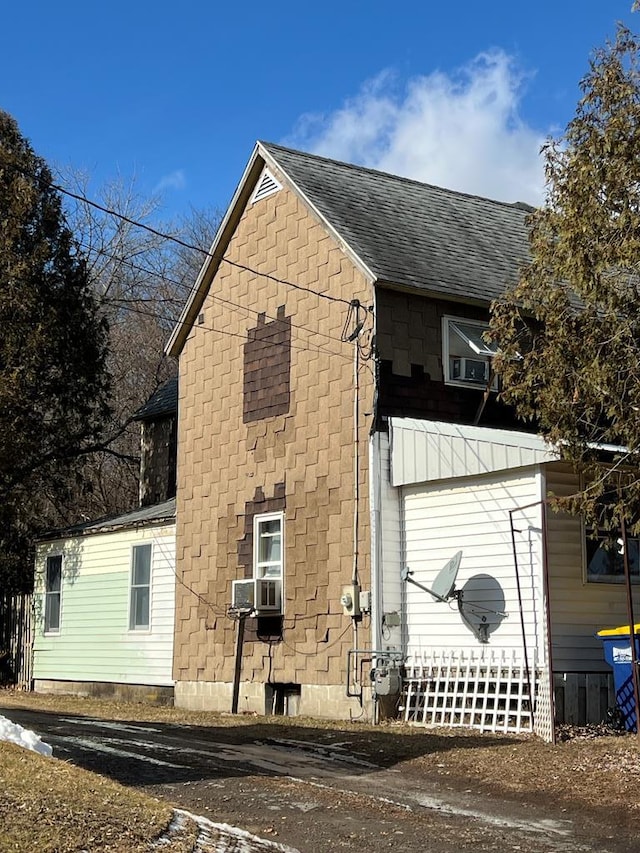 view of home's exterior with cooling unit