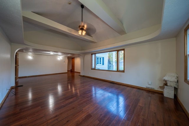 unfurnished living room with ceiling fan and dark hardwood / wood-style floors