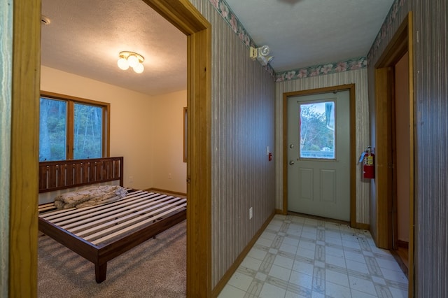 entryway featuring a textured ceiling