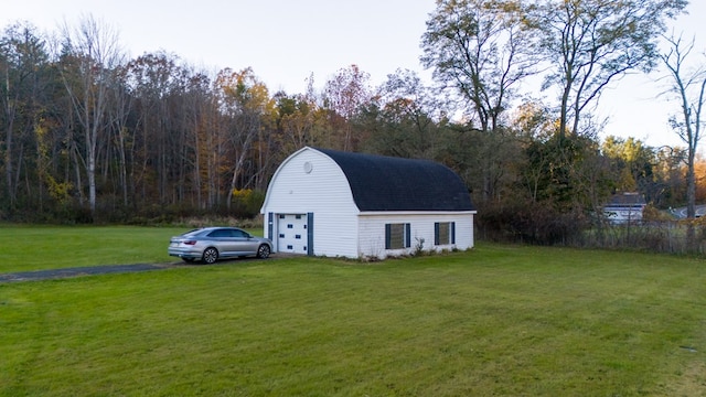 view of outbuilding featuring a yard and a garage