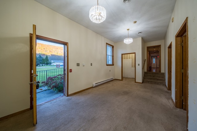 interior space featuring carpet, a notable chandelier, and a baseboard heating unit