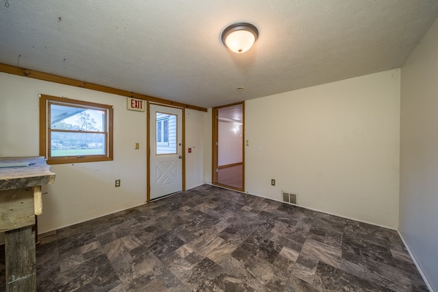 interior space with a textured ceiling