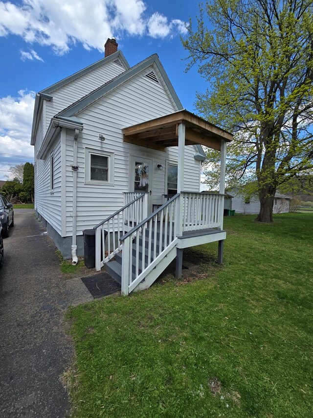 97 Lincoln St, Sayre, PA 18840 - view of front of house with a chimney and a front lawn