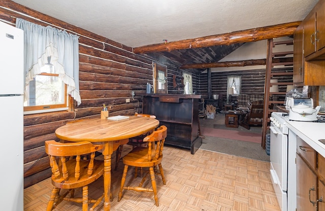 169 Horton Hollow Ln, Tioga, PA 16946 - dining area with beam ceiling and a textured ceiling