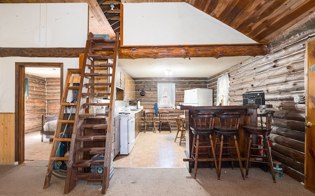 169 Horton Hollow Ln, Tioga, PA 16946 - kitchen featuring high vaulted ceiling, wainscoting, washer / clothes dryer, wooden ceiling, and freestanding refrigerator