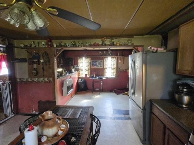 79 Back St, Millerton, PA 16936 - kitchen featuring heating unit, freestanding refrigerator, and dark countertops