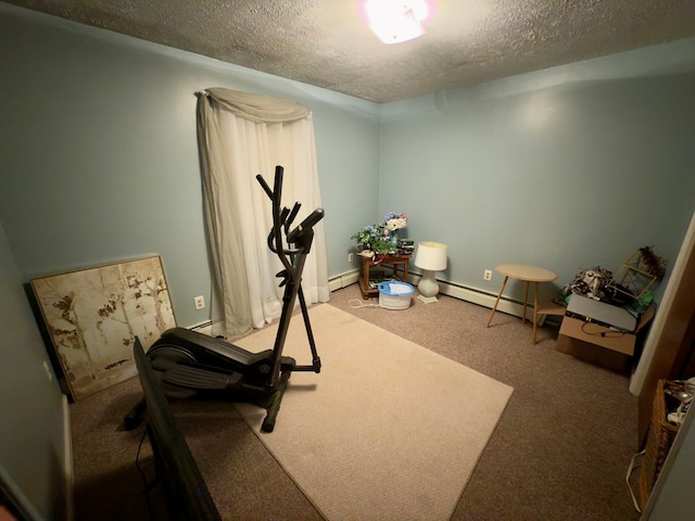 workout area featuring carpet flooring, a textured ceiling, and baseboard heating