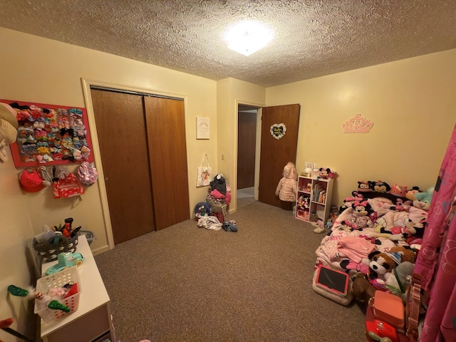 game room featuring carpet and a textured ceiling