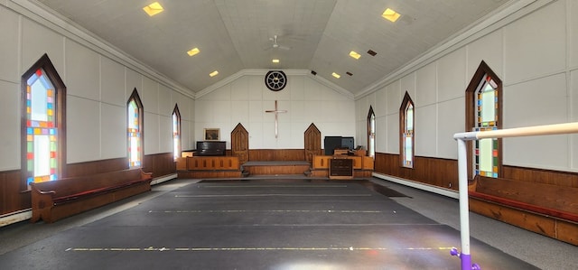 playroom featuring vaulted ceiling, ceiling fan, and ornamental molding