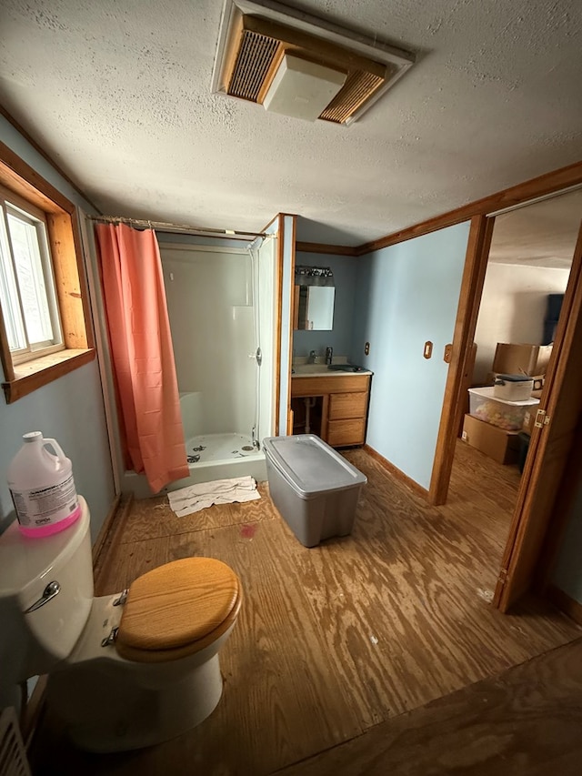 116 Morral Rd, Wellsboro, PA 16901 - bathroom with a shower stall, a textured ceiling, toilet, and wood finished floors