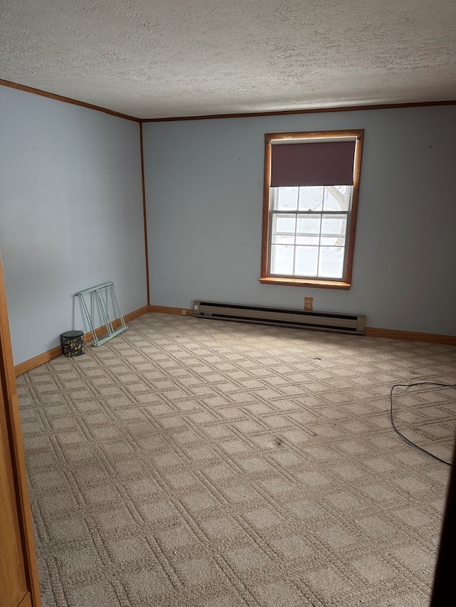 116 Morral Rd, Wellsboro, PA 16901 - carpeted spare room featuring baseboards, a baseboard heating unit, ornamental molding, and a textured ceiling