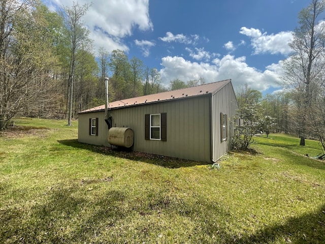 16 Quarry Ln, Galeton, PA 16922 - view of home's exterior with a yard, metal roof, and heating fuel