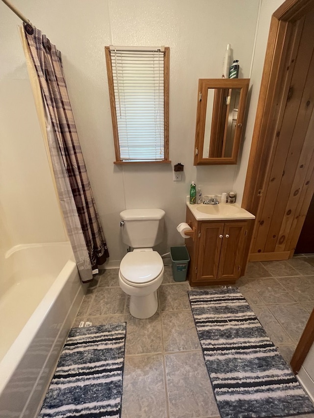 16 Quarry Ln, Galeton, PA 16922 - bathroom featuring toilet, tile patterned flooring, shower / bath combo, and vanity