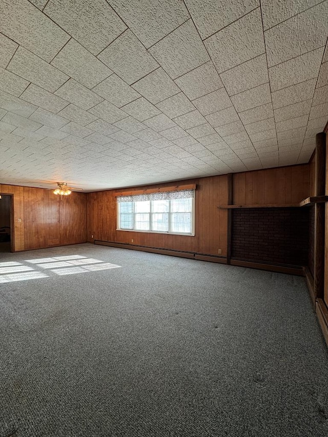 empty room with carpet and wooden walls