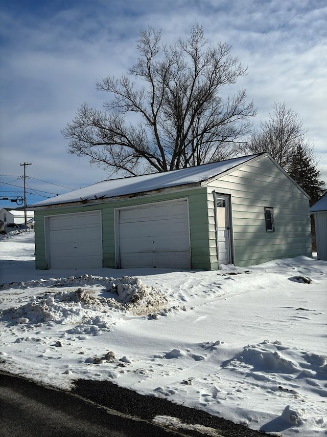 view of snow covered garage