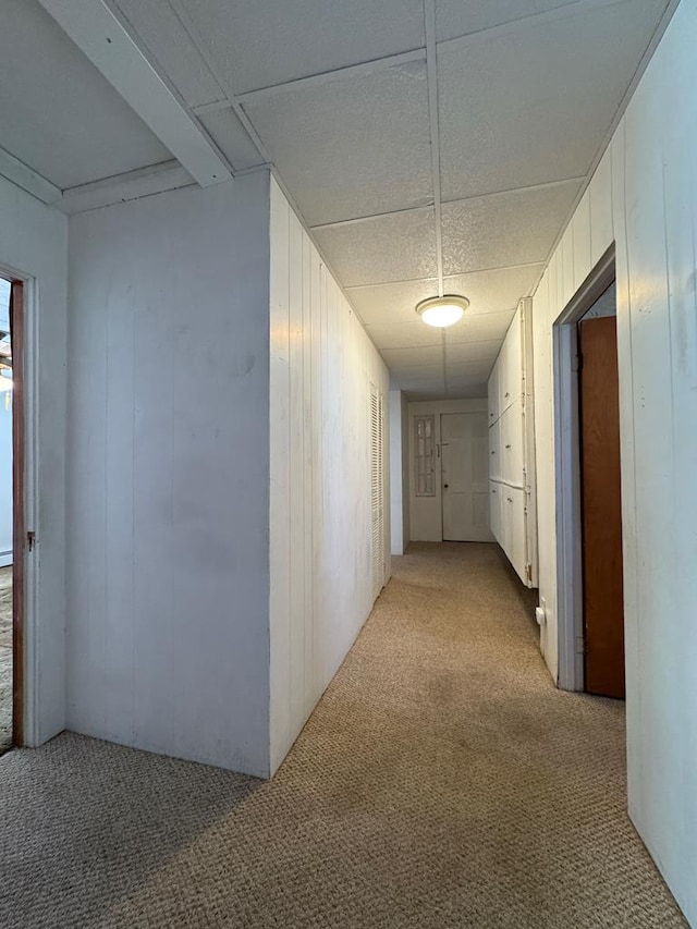 hall featuring light colored carpet