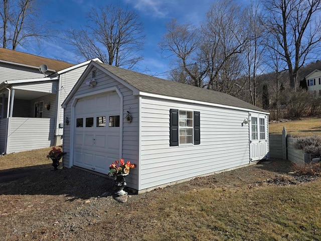 detached garage featuring driveway