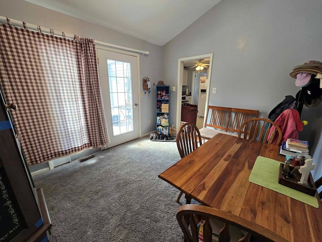 dining area with carpet flooring, baseboards, visible vents, and vaulted ceiling