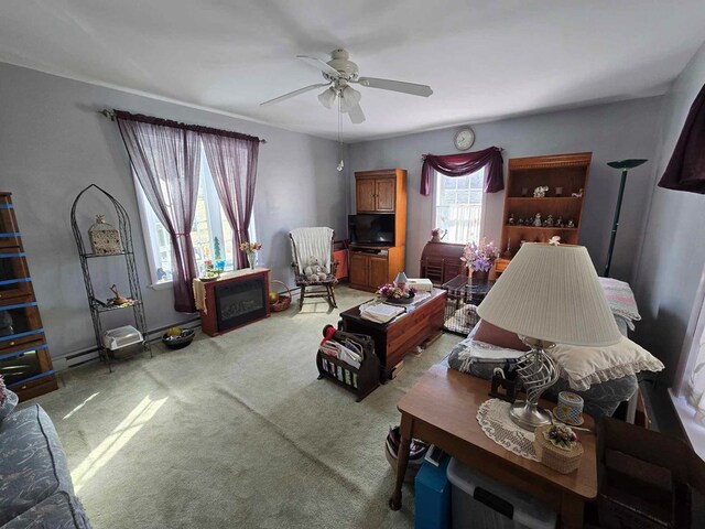 living area with light colored carpet and ceiling fan