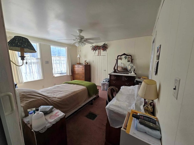 carpeted bedroom featuring ceiling fan