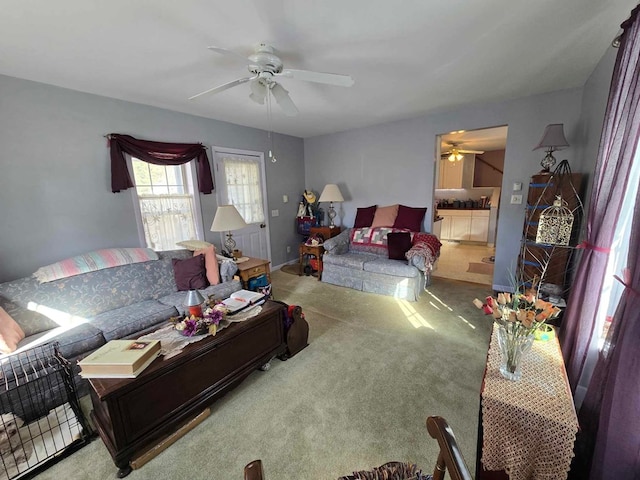 living room with carpet floors and a ceiling fan