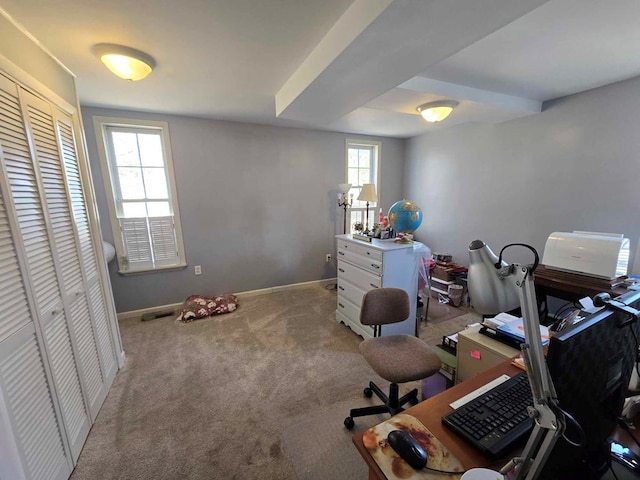 office area with visible vents, baseboards, and carpet