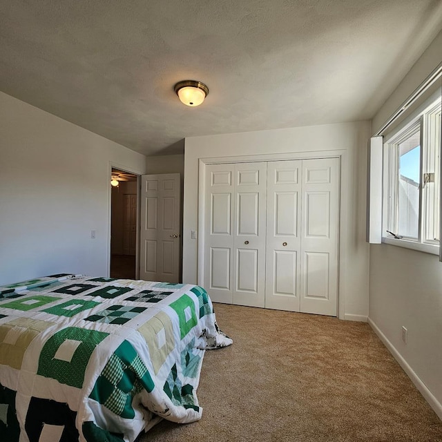 carpeted bedroom with a closet