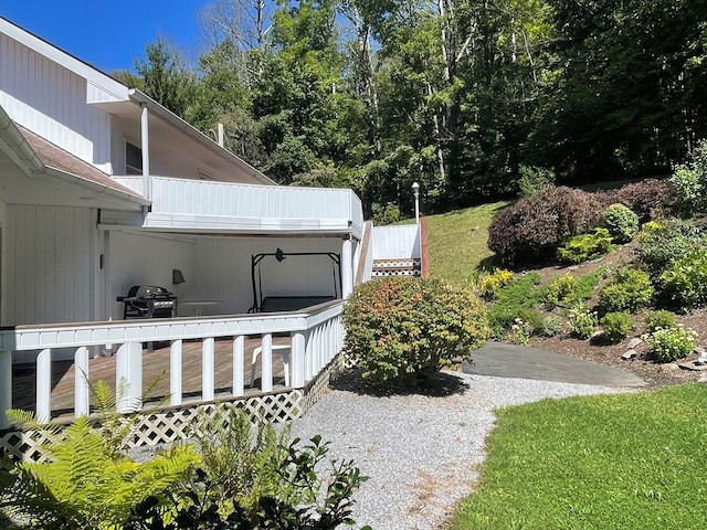 view of yard featuring a wooden deck