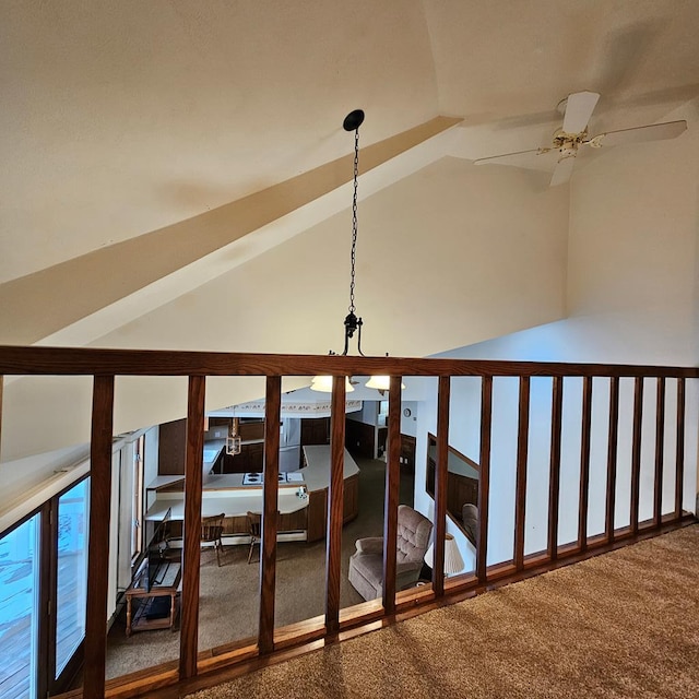 hallway featuring lofted ceiling and carpet floors