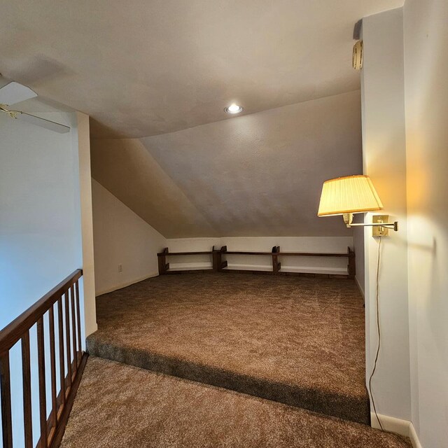 bonus room with lofted ceiling, carpet floors, and ceiling fan