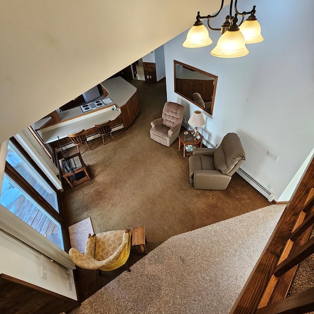 living room with baseboard heating and carpet