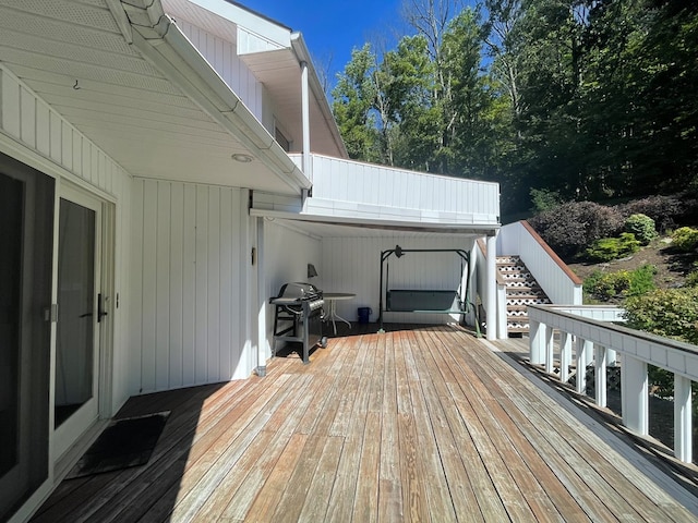 wooden terrace with area for grilling