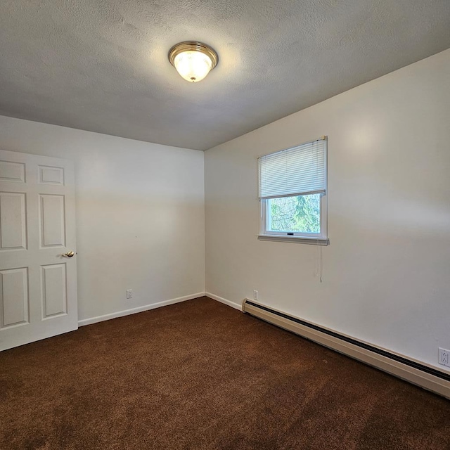 unfurnished room with dark colored carpet, a textured ceiling, and baseboard heating