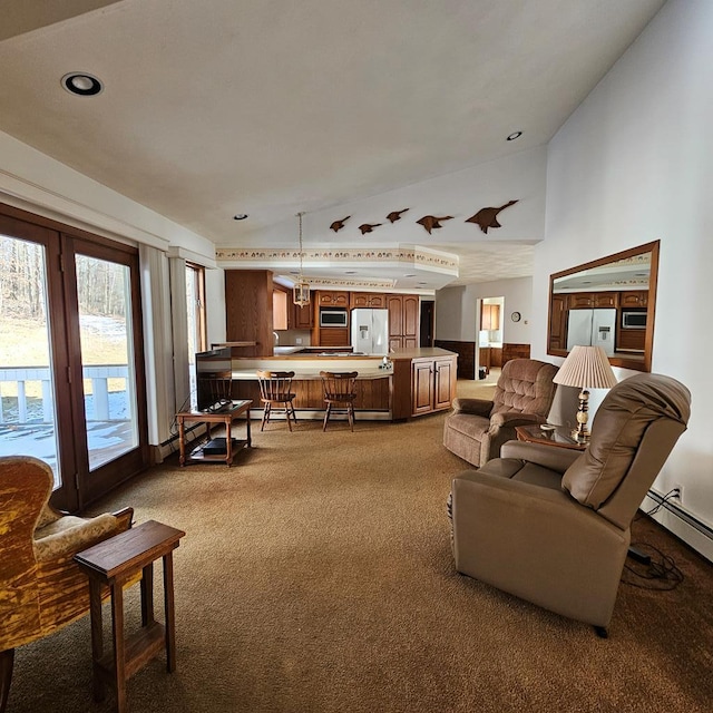 carpeted living room with high vaulted ceiling