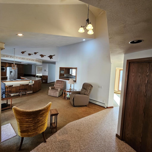 carpeted living room featuring a baseboard heating unit, high vaulted ceiling, and a textured ceiling