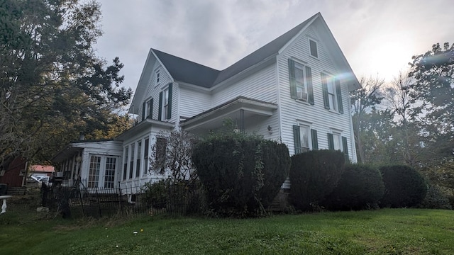 view of home's exterior featuring a lawn