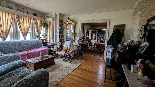 living room featuring hardwood / wood-style floors and ornamental molding