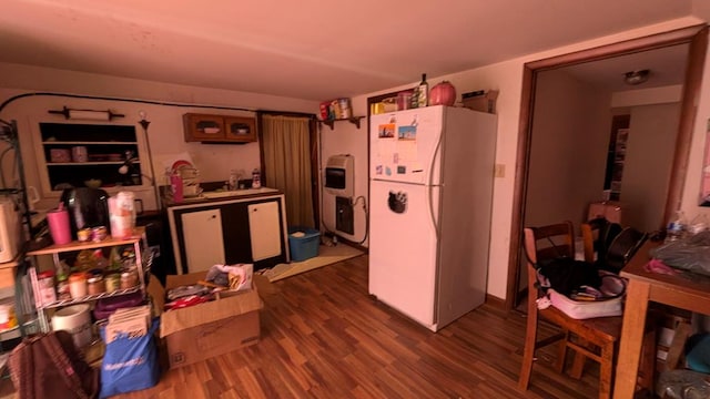 kitchen featuring white refrigerator and wood-type flooring