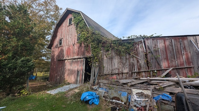 view of property exterior featuring an outdoor structure