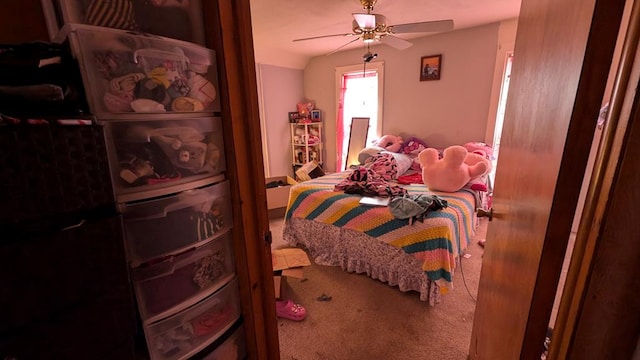 carpeted bedroom with ceiling fan and lofted ceiling