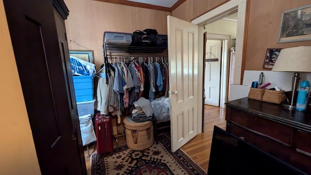 spacious closet with light hardwood / wood-style flooring