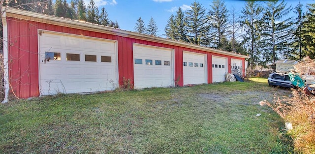 garage featuring a lawn