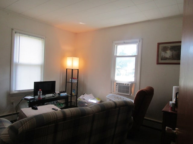 living room with cooling unit and a baseboard radiator