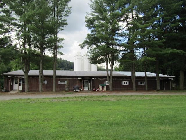 ranch-style house with a front lawn