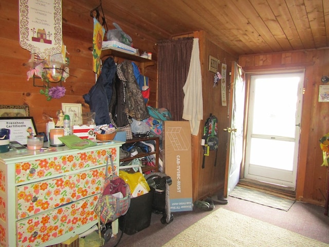 miscellaneous room with wood walls, carpet, and wood ceiling